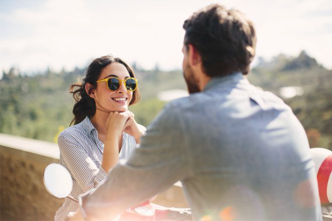 Young couple travelling through Italy on a scooter